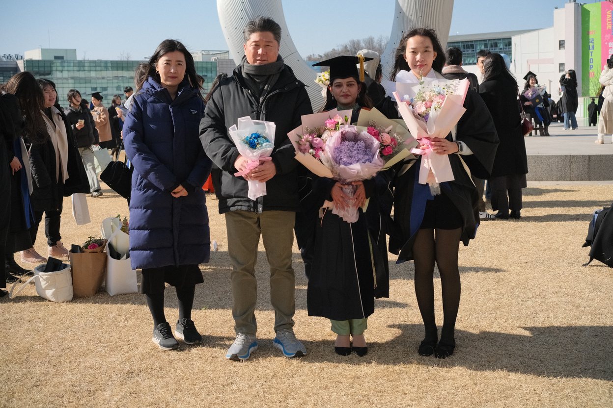 Lab members at a graduation ceremony on campus